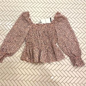 Pink and black puffy long sleeve shirt